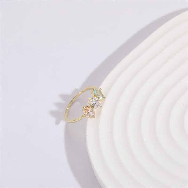 Geometric triangular copper women's ring with tricolour zircon stones and electroplated gold colour finish