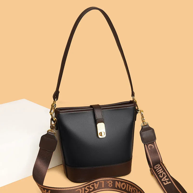 Korean style black bucket bag with dual shoulder straps and multiple internal zippered compartments