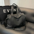 Large black waterproof travel backpack with multiple compartments shown opened to display interior organisation