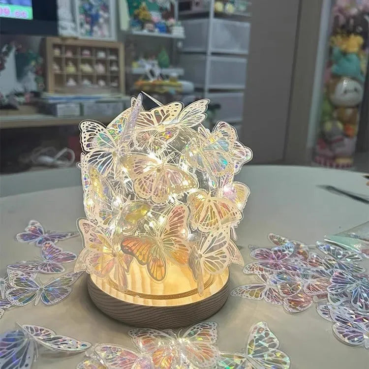 Butterfly night lamp with glass lampshade and raw wood base measuring 12x15cm