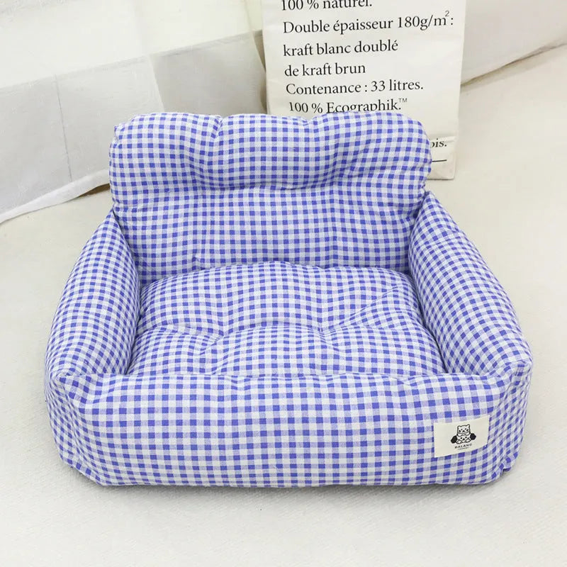 Blue plaid and grey cloth pet travel nests for cars in small and large sizes.