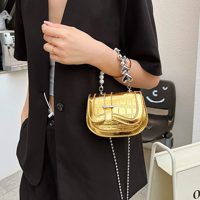 Silver PU leather women's crossbody bag with a horizontal square shape and single shoulder strap.