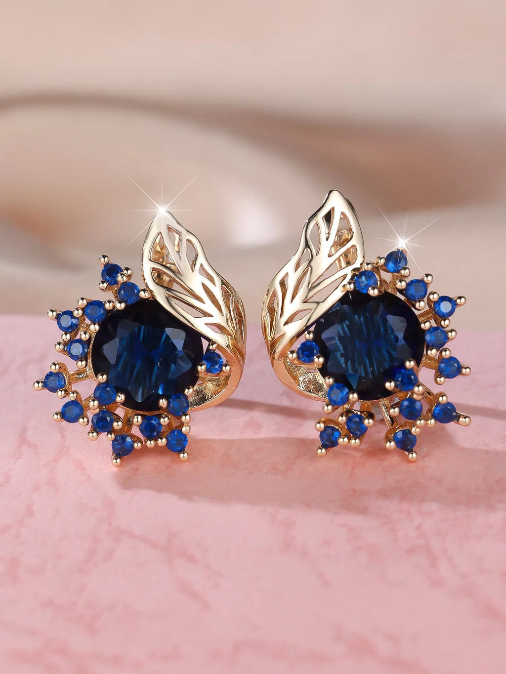 Round floral earrings with feather zircon arrangement in champagne gold with six diamond colour options