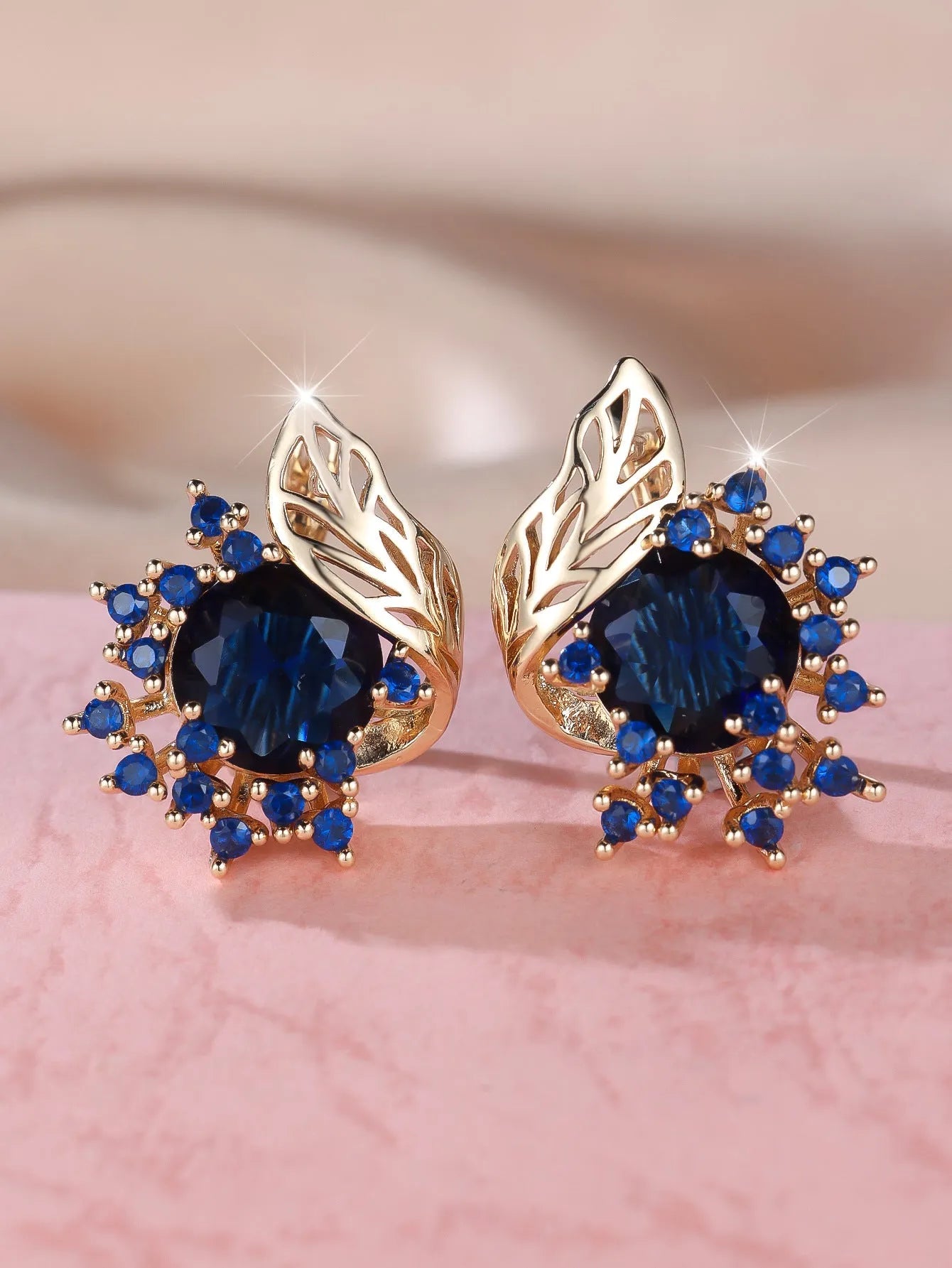 Round floral earrings with feather zircon arrangement in champagne gold with six diamond colour options