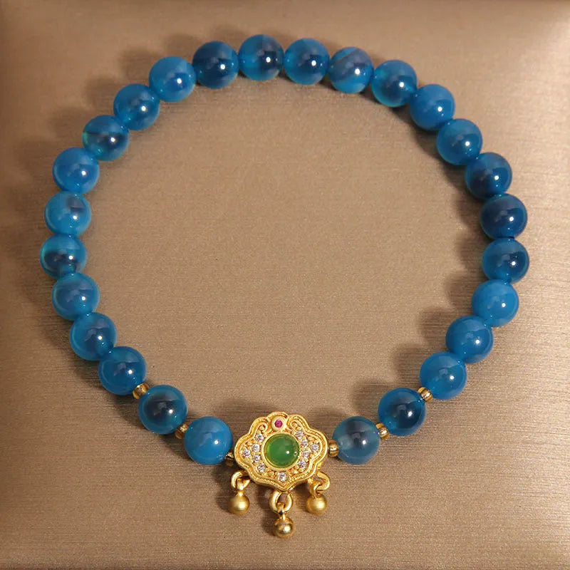 Women's blue agate safety lock pendant bracelet with crystal and rhinestone details