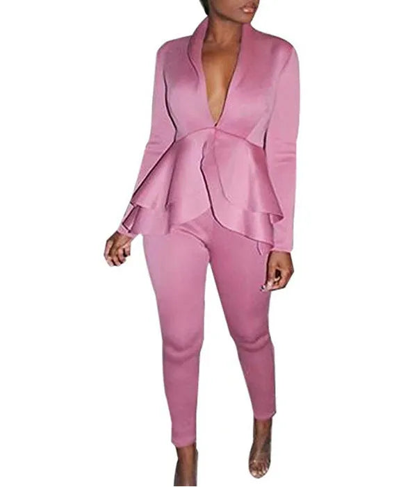 White ruffled business casual shirt and matching pencil pants set laid flat.