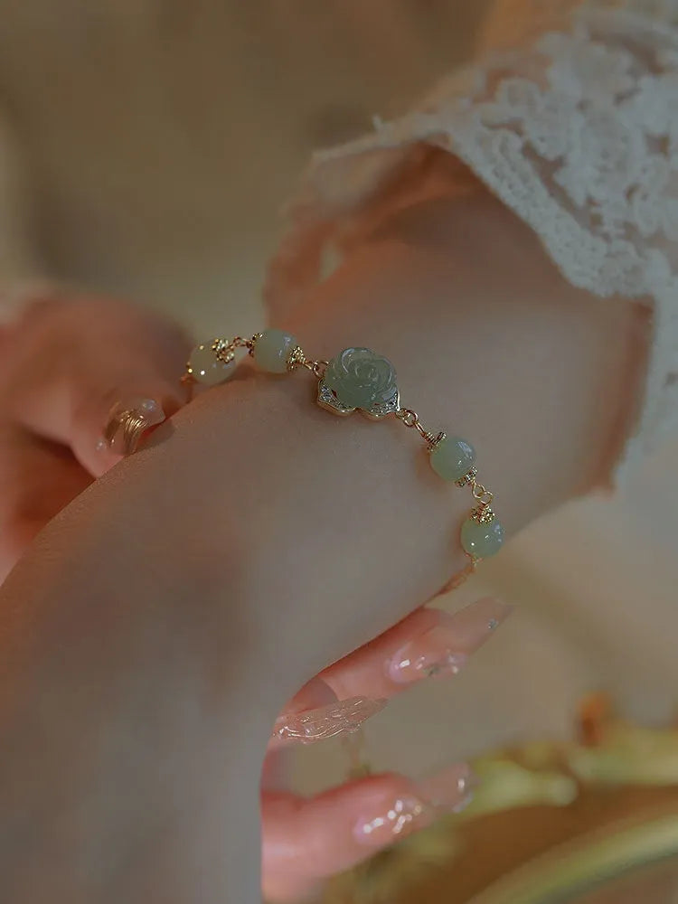 Women's bracelet with Hetian jade rose design and 14K gilded floral elements