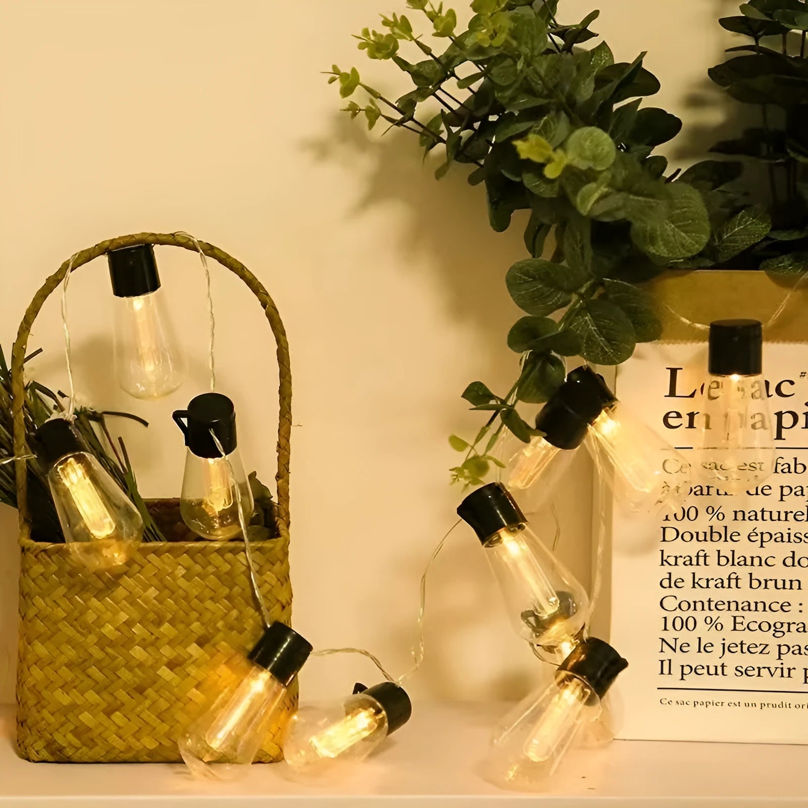 Retro outdoor string lights with infusion bottle-shaped bulbs in garden setting