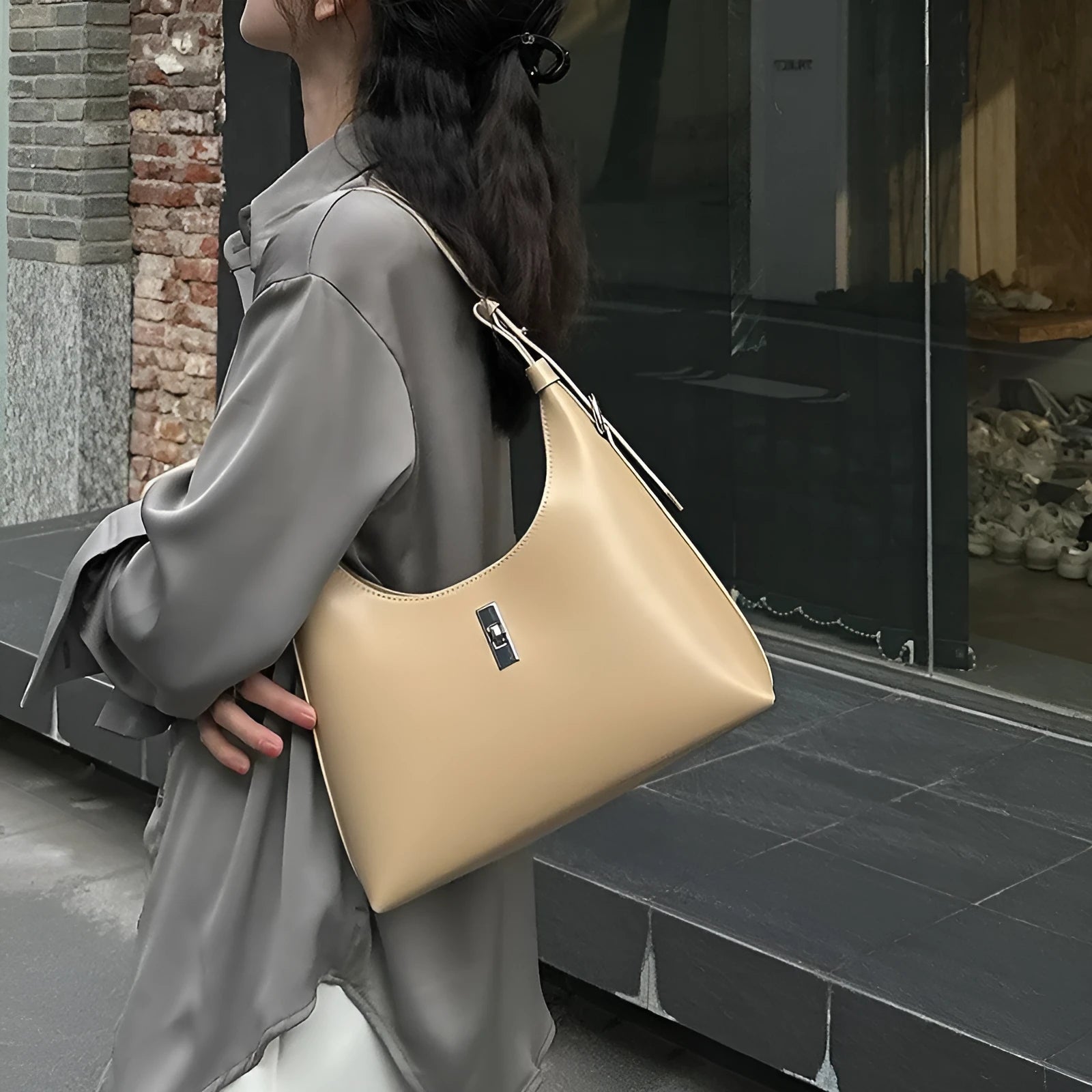 Women's genuine leather dumpling-shaped crossbody shoulder bag in apricot colour with a sandwich pocket.