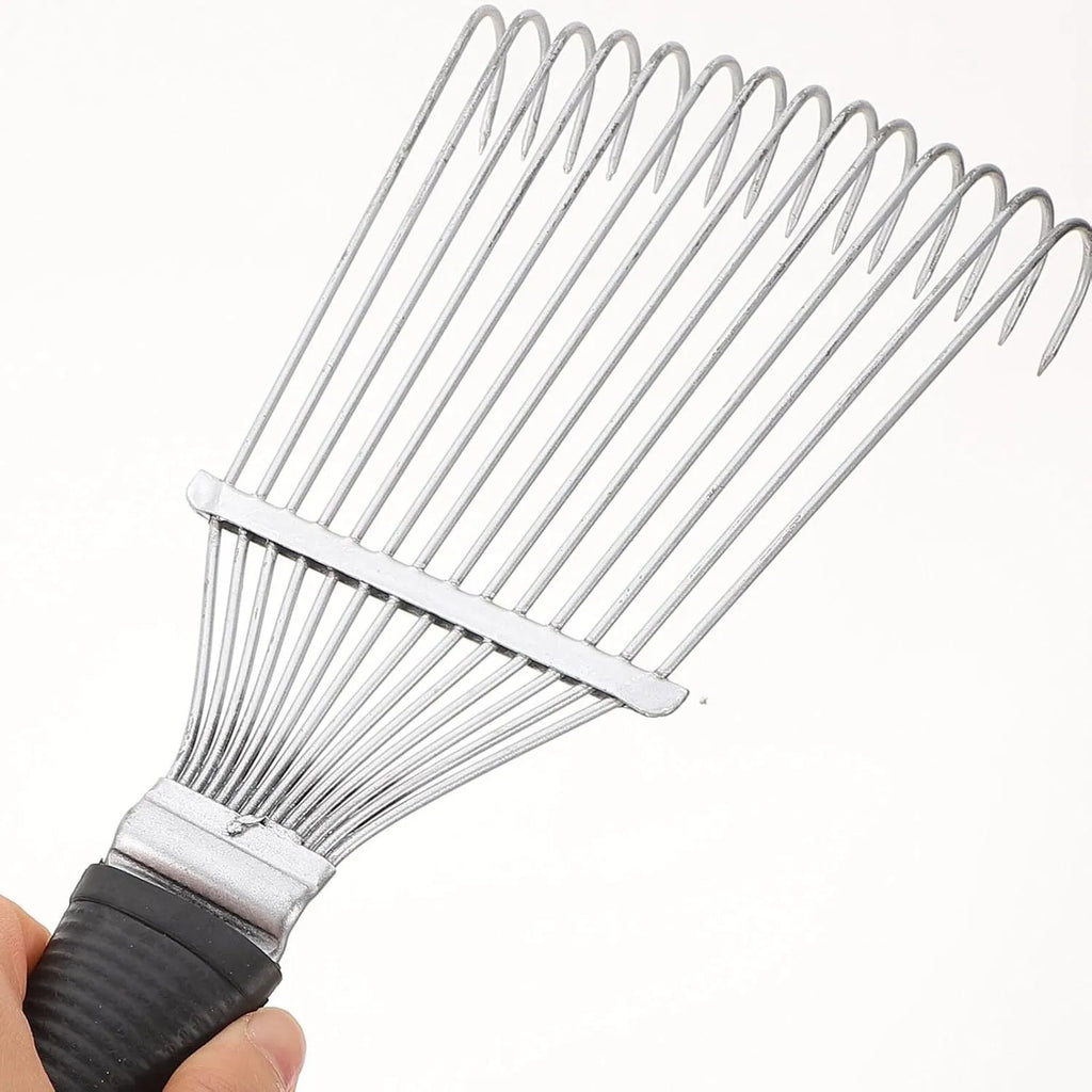 Stainless steel dematting brush rake comb for dog and horse grooming on a table.