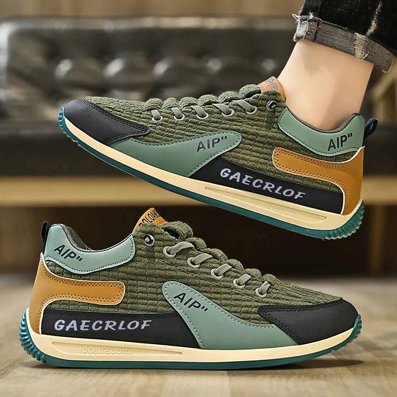 Men's green and grey low-top mesh running shoes with round toe and lace-up front.