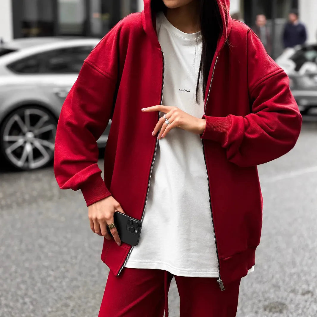 Red loose fit street style coat and trousers two-piece set on a hanger.