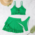 Women's solid colour three-piece swimsuit with bikini top, bottoms, and split hip skirt.