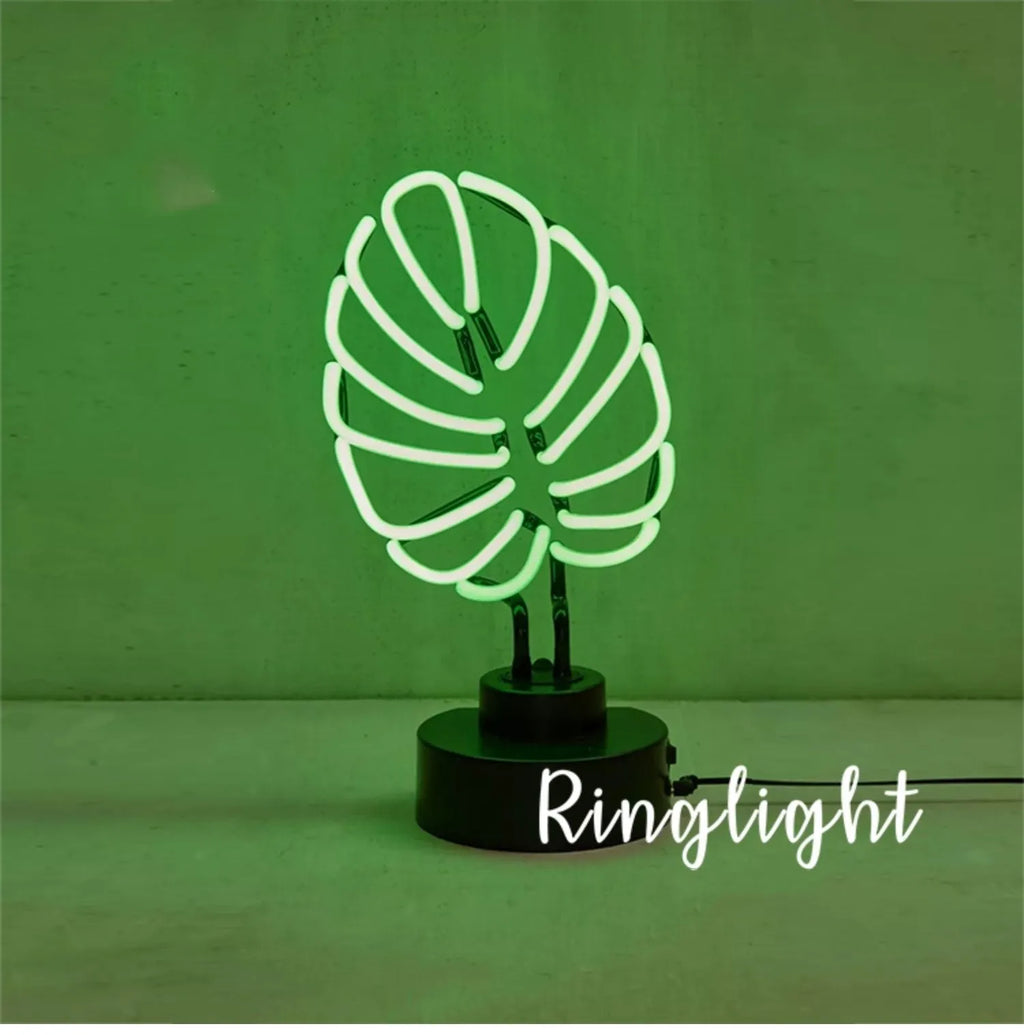 White bamboo-shaped desk lamp with green light, showing large and small size options.