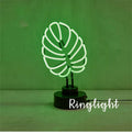 White bamboo-shaped desk lamp with green light, showing large and small size options.