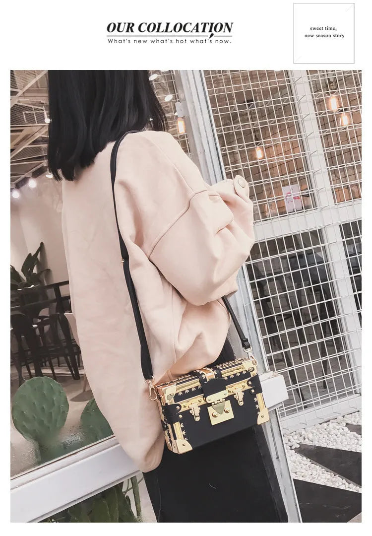 Black hard PU leather women's shoulder bag with flap, hasp closure, and rivet decoration.