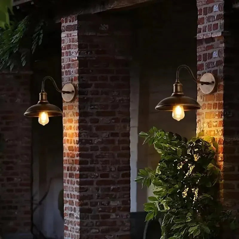 Retro style exterior wall lamp for villa courtyards in copper or silver finish with right angle or bevel mount options.