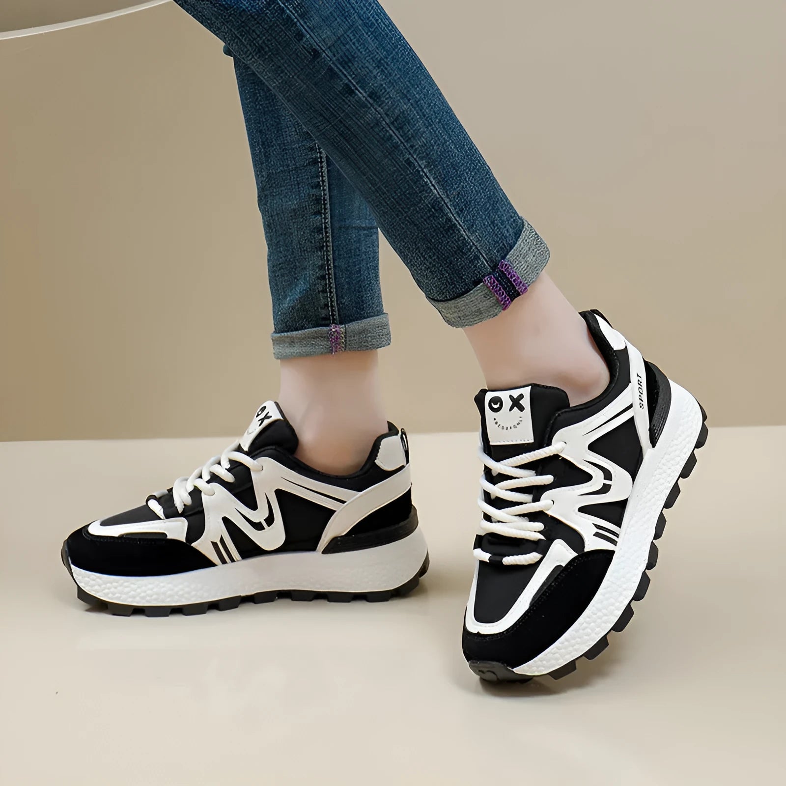 Women's black platform casual shoes with round toe and front lace-up design on a neutral background.