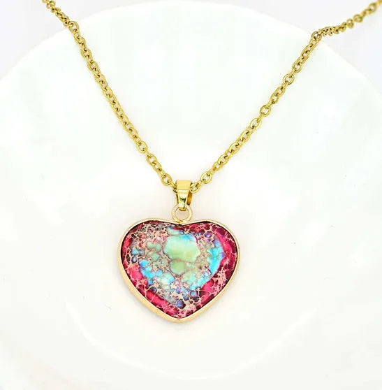 Red and blue heart-shaped emperor stone pendant necklace on a metal chain