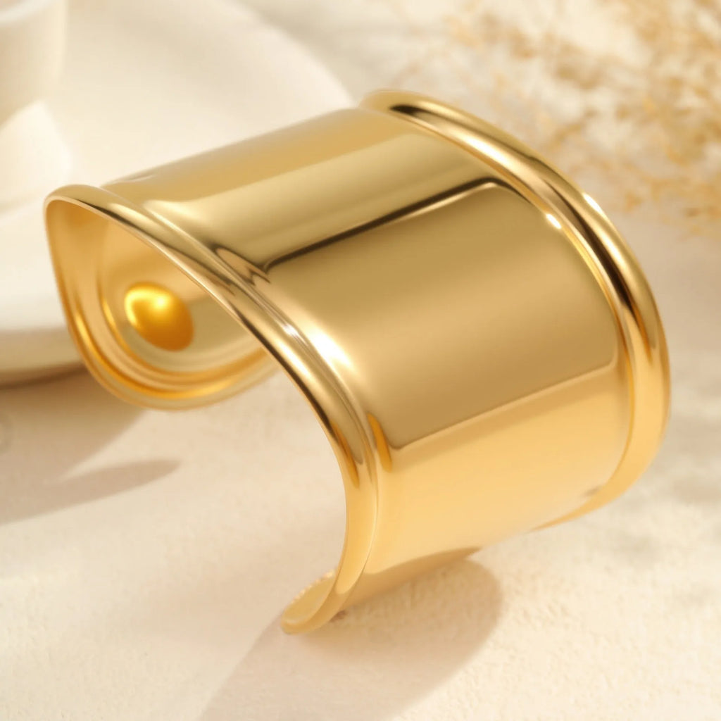 Women's wide stainless steel bracelet with gold plating and niche opening design