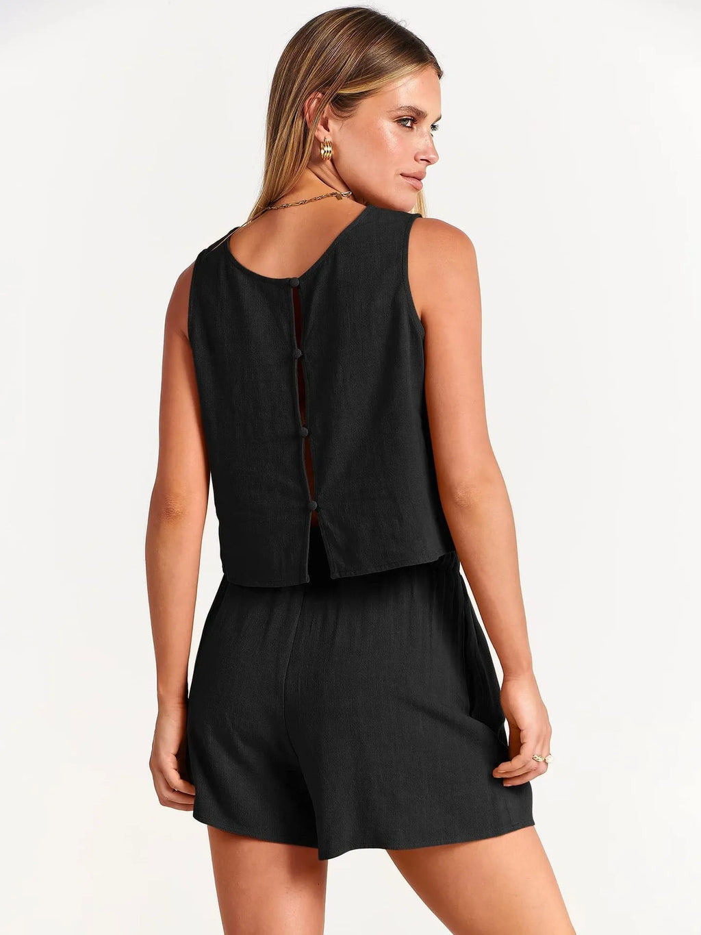 Women's summer two-piece set showing sleeveless top and matching drawstring shorts in solid colour