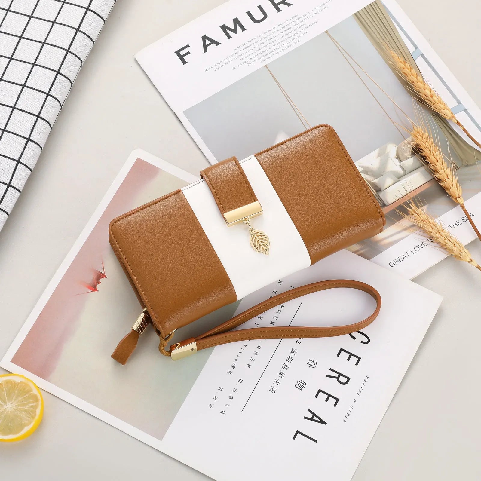 Anti-theft clutch handbag with lock and brush compartment in PU leather, shown in black colour.