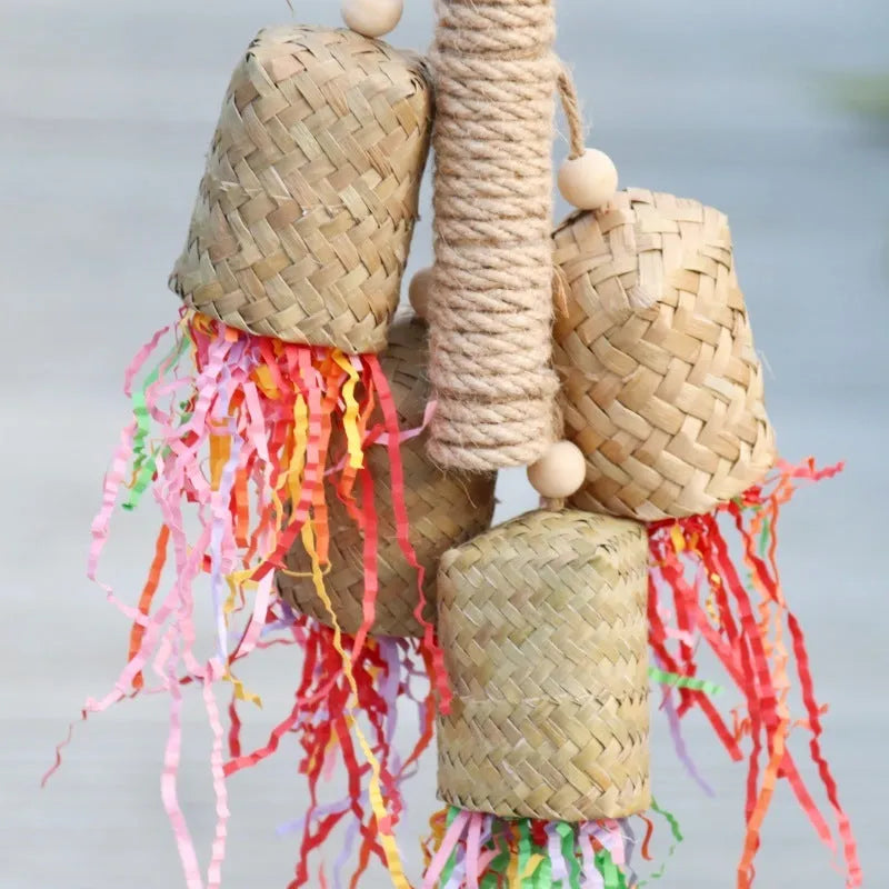 Wood and sisal rope parrot toy with colourful shredded paper strands for foraging.