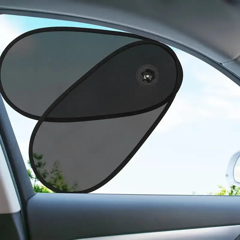 Black stretchy car side window sun shade attached with suction cups, showing adjustable coverage.
