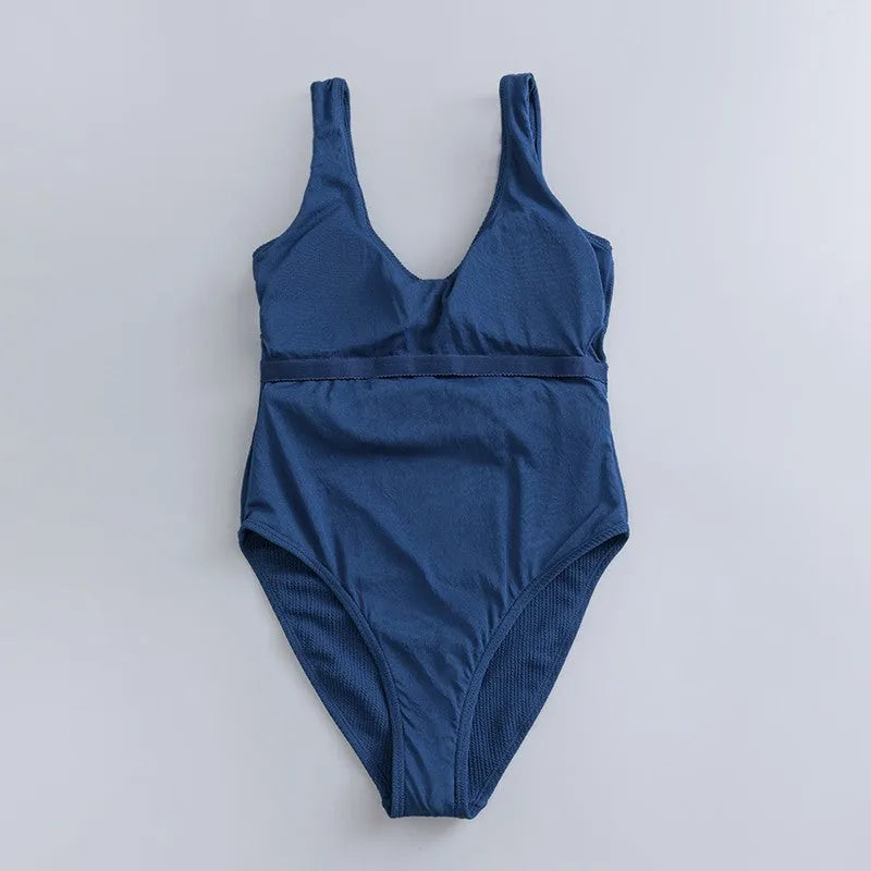 Navy blue women's one-piece slimming swimsuit with triangle design and chest pad