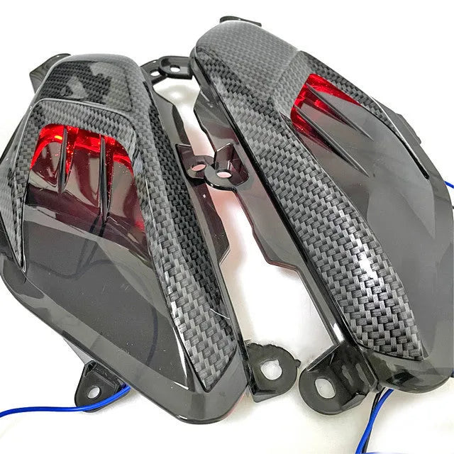 Pair of YAMAHA NMAX LED side lamps with carbon fibre decoration and choice of blue or red light.