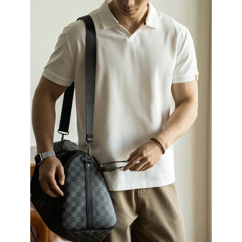 Men's blue cotton blend short-sleeve polo shirt on a hanger, showing the collar and regular fit.