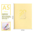 A5 daily planner notebook with faux leather cover open on a desk
