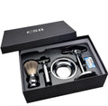 CSB men's shaving set with chrome double edge razor, badger hair brush on stand, zinc soap bowl, and blades in black box.