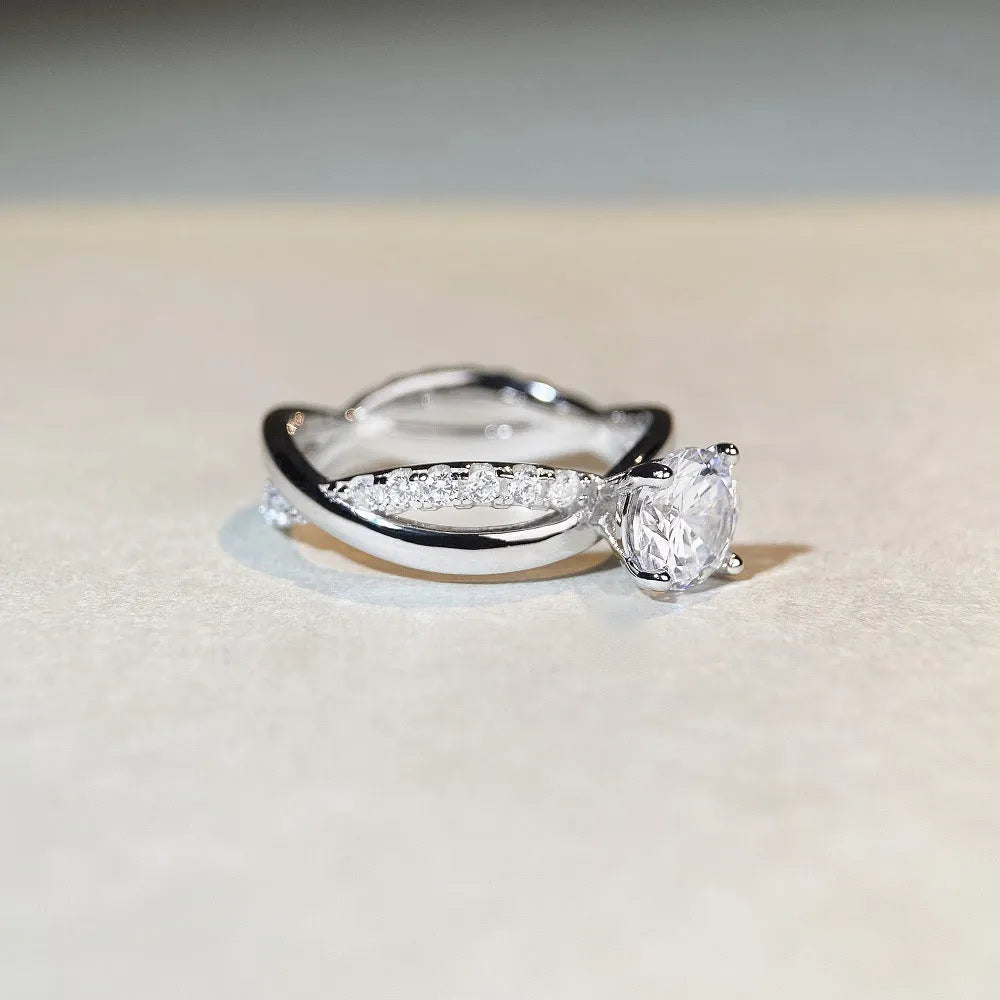 White Diamond 1 karat moissanite ring with twisted Sterling Silver band and four-claw setting.