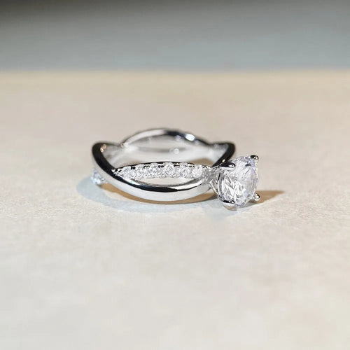 White Diamond 1 karat moissanite ring with twisted Sterling Silver band and four-claw setting.