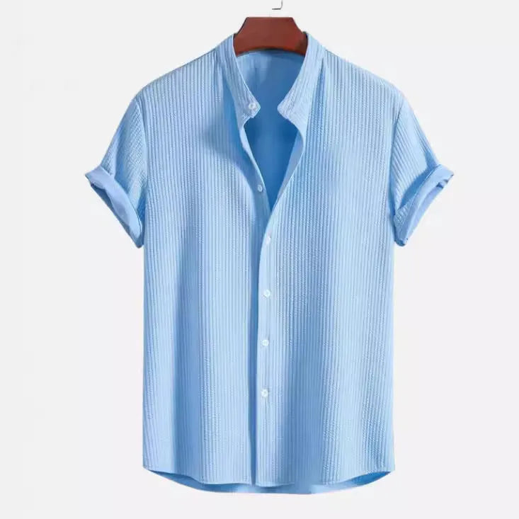 Men's loose fit short sleeve polyester shirt in multiple colours on a size chart background.
