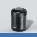 Black portable Bluetooth speaker showing front grill and controls.