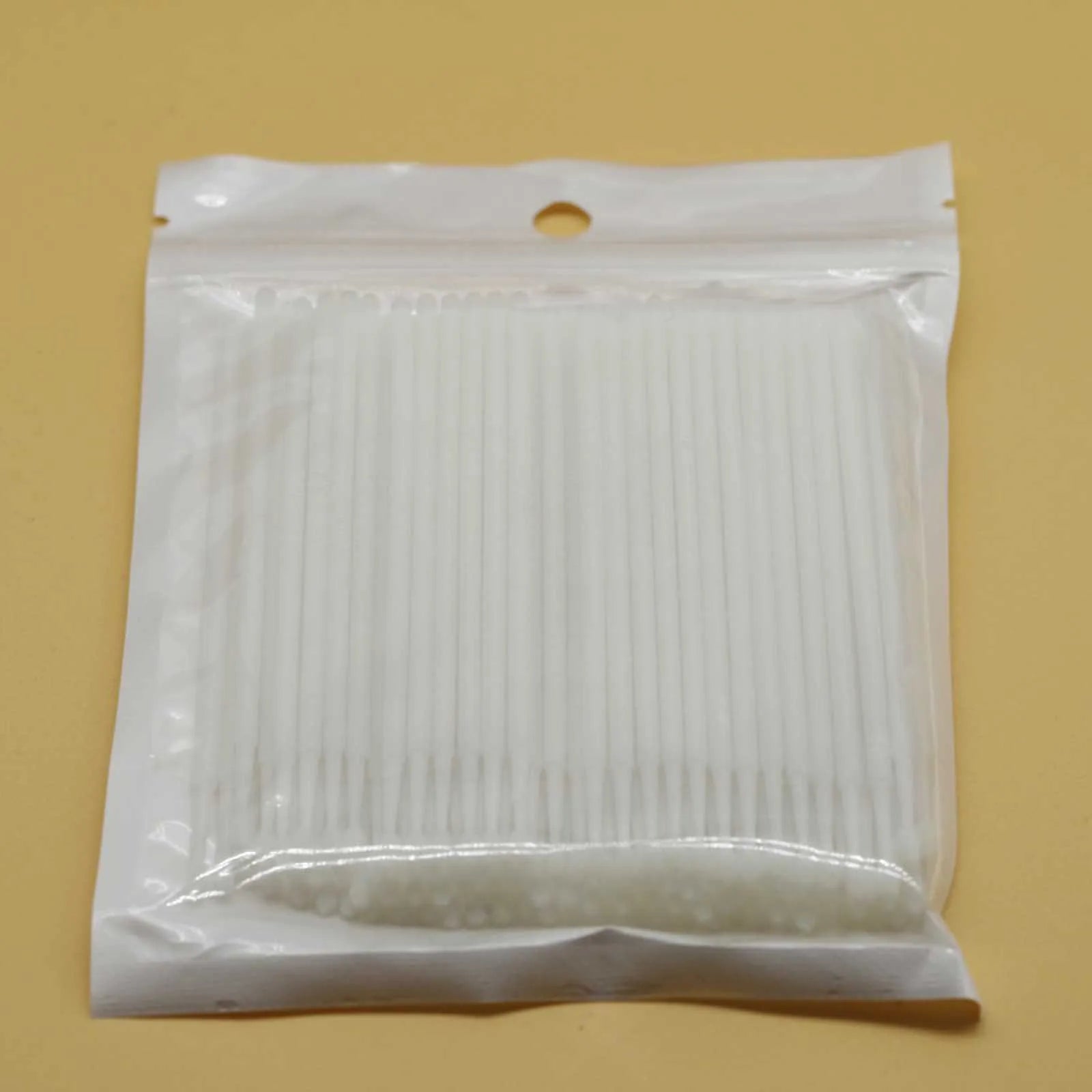 Disposable micro applicator brushes with colourful handles and bendable cotton swabs for makeup and eyelash extensions
