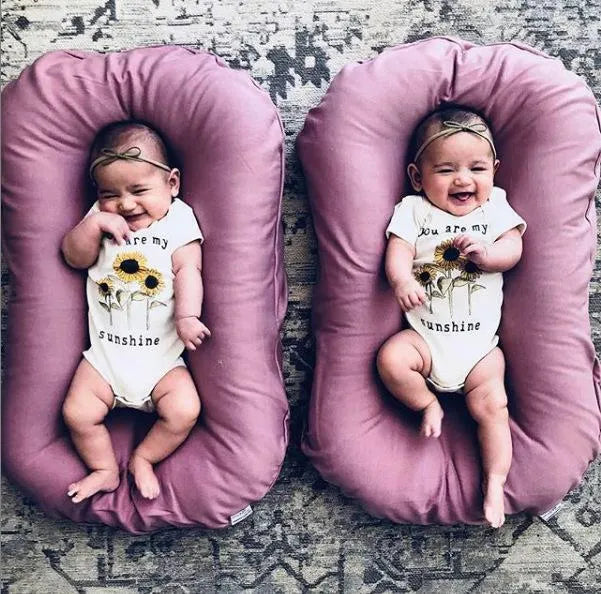 Portable baby nest crib measuring 75x45cm in cotton fabric with PP cotton filler