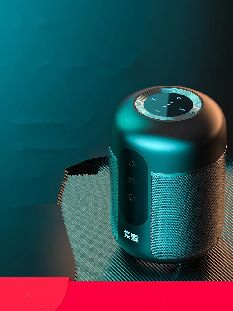 Black portable Bluetooth speaker showing front grill and controls.