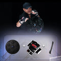 Black wall-mounted boxing target with coloured LED lights and Bluetooth connectivity for fitness training