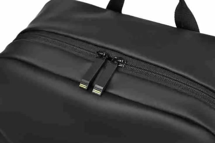 Large black waterproof PU backpack with sewing thread details and separate laptop bag