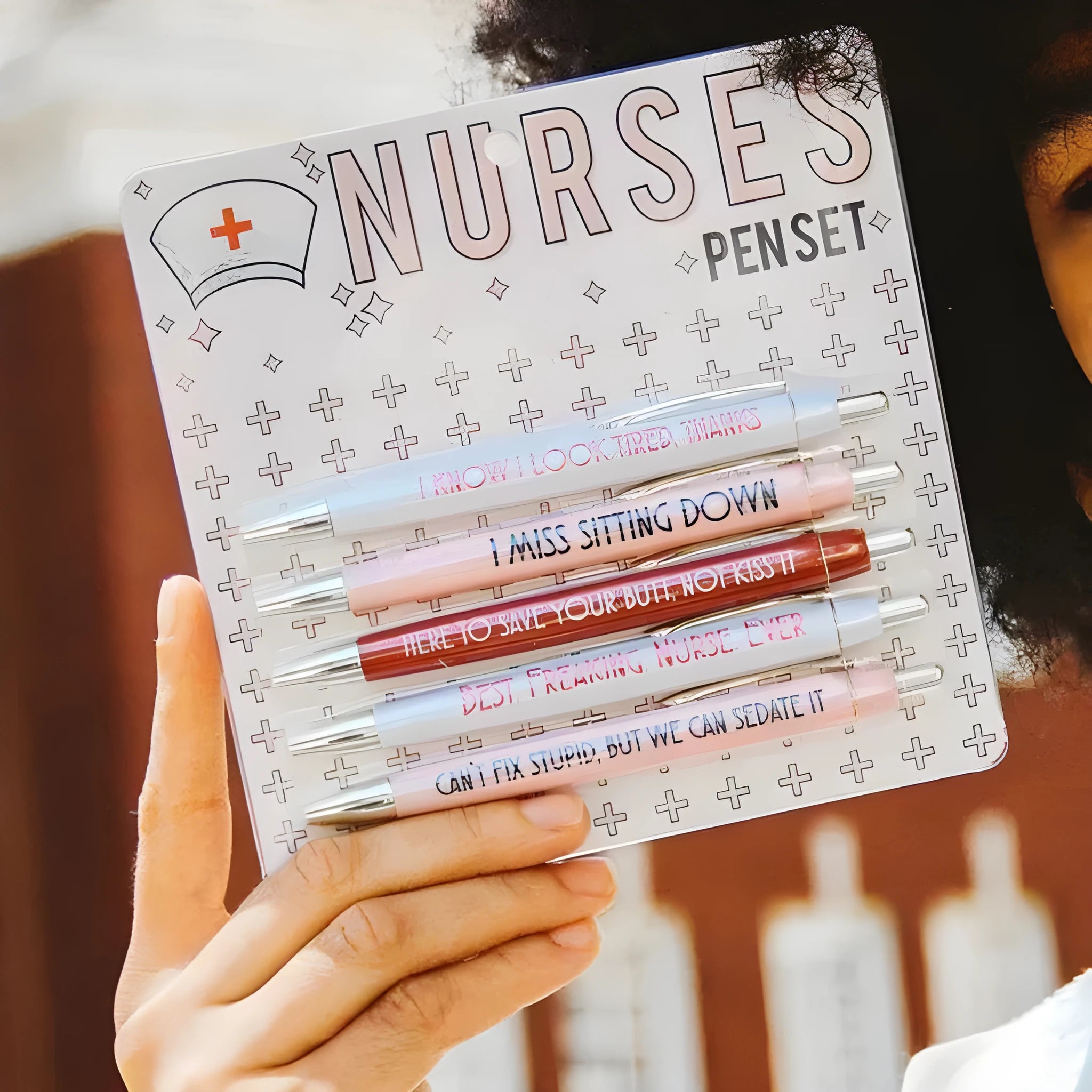 Five nurse-themed ballpoint pens with humorous medical copywriting in plastic retractable design