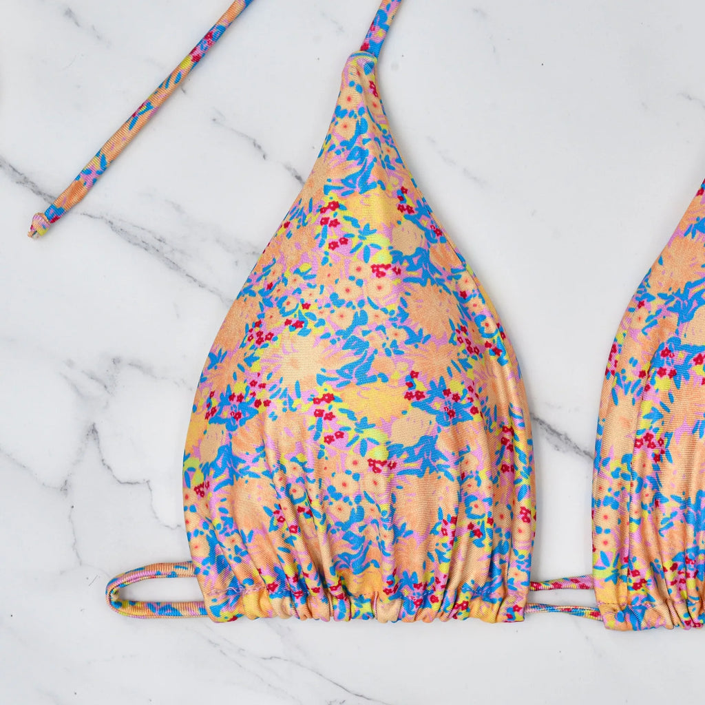 Women's lace-up bikini swimsuit in picture colour, showing backless design and high elasticity fabric.