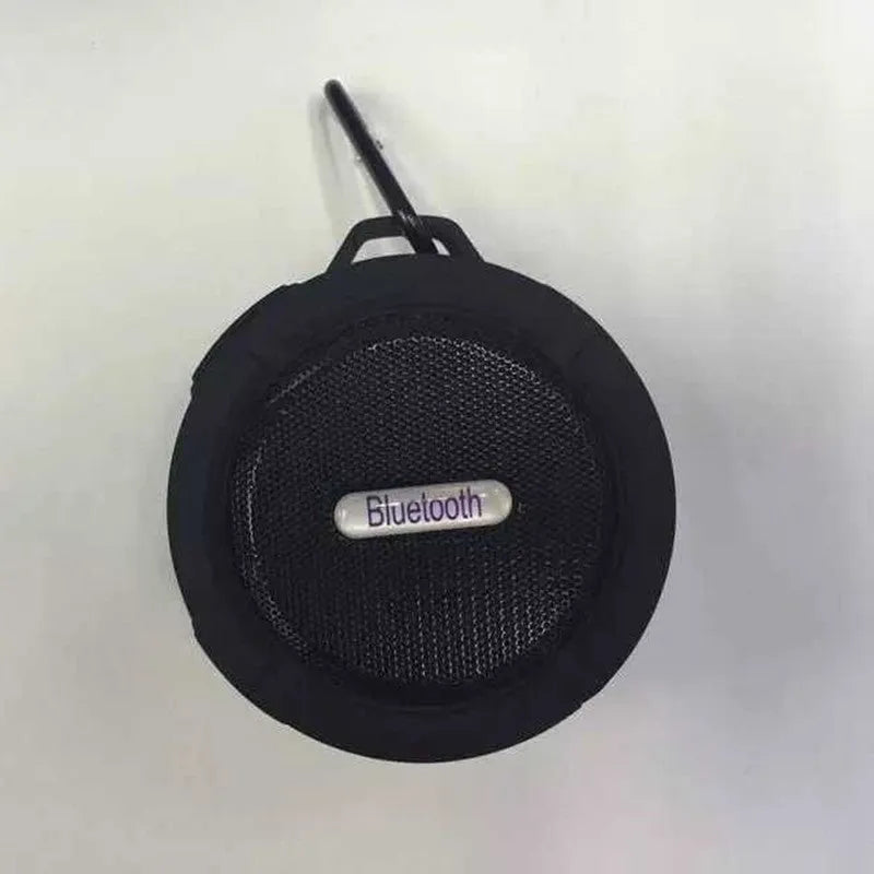 Portable waterproof Bluetooth speaker with carabiner clip in black, blue, green, red, or yellow colours