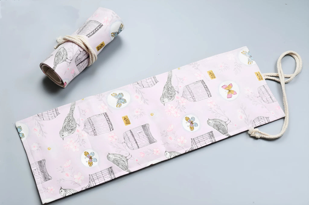 Canvas pencil wrap with multiple elastic bands rolled up showing slot configuration