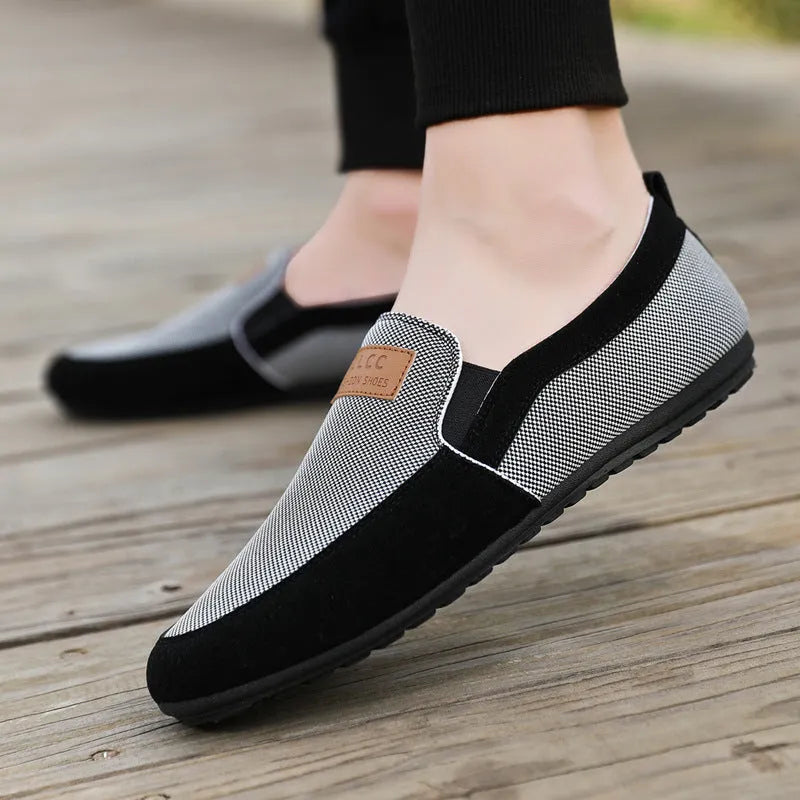 Men's grey and khaki canvas casual shoes with round toe and stitching detail.