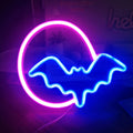 Halloween bat neon lights in pink blue and red blue colours on a dark background