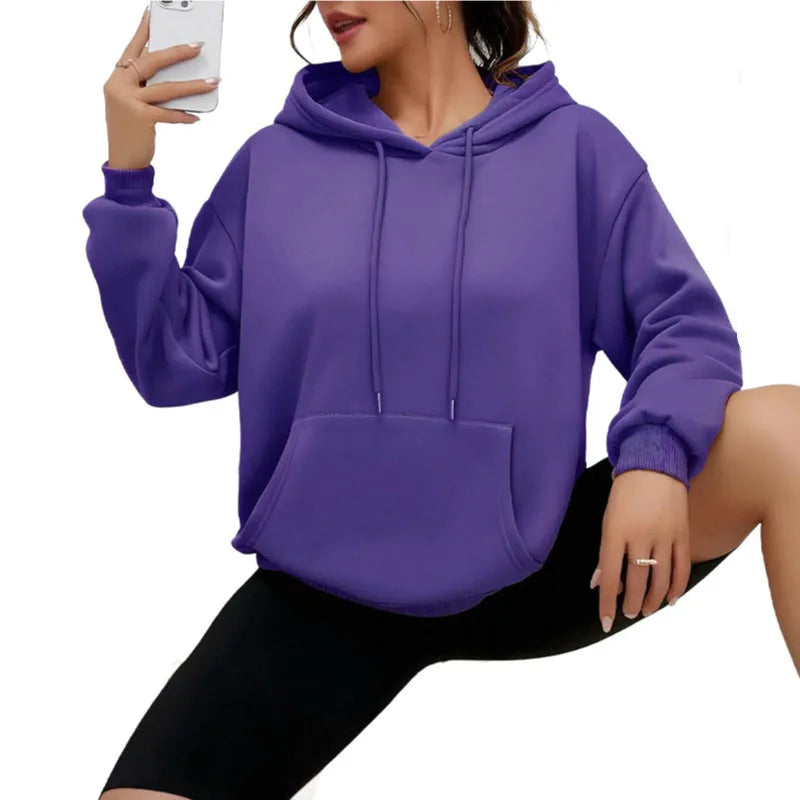 Women's loose grey sweatshirt with drawstring pockets and long sleeves