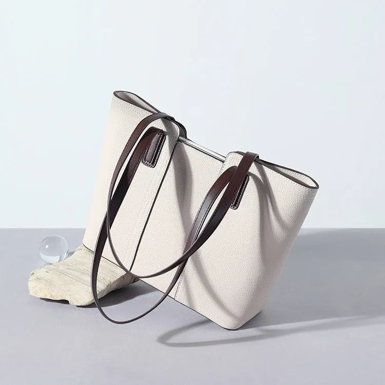 Women's genuine leather commuter shoulder bag in khaki colour showing box-type shape and shoulder strap